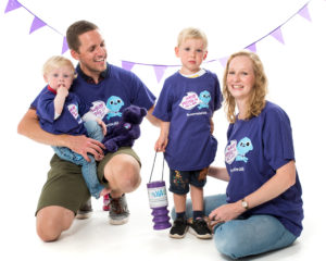 Family wearing Wear purple t-shirt